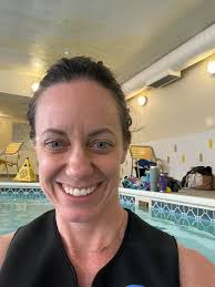 Family swimming together in a pool