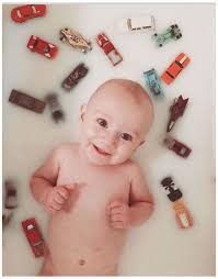 Do not bathe baby in a tub of water until the umbilical cord falls off. Baby Boy Milk Bath Photography Babyboymilkbathphotography Baby Boy Milk Bath Milk Bath Photography Baby Boy Pictures Bath Pictures