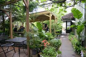 Pusadee S Garden Charming Little Spot In Lawrenceville Filled With Big Flavor Charming Garden Outdoor Living Rooms Amsterdam Apartment