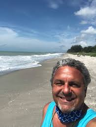 Buy the beach house... there's no point being the richest person in the  cemetery