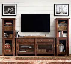After contemplating how to decorate the space, we decided to splurge and purchased the logan media suite from pottery barn. Benchwright 109 Entertainment Center Pottery Barn