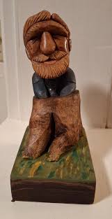 Carving a figure out of cherry wood from Virginia