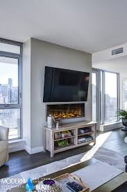 You should consider features while shopping for an electric fireplace, too. Check Out This Family Room With A Panoramic View Of Seattle Featuring Our Electric Fireplace Fireplace Home Fireplace Fireplace Heat