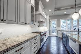 Go for yellow walls and grey cabinetry or vice versa depending on the effect you want to produce with your kitchen. Traditional Kitchen With White Lower Cabinets And Gray Upper Cabinets With Blackened Hickory Floor Gray And White Kitchen Upper Kitchen Cabinets Kitchen Design