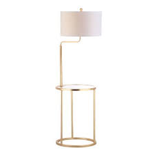 This isolda 60 tripod floor lamp with steel tripod design and fabric lampshade is a classic and elegant decoration and will bring you a peaceful and nice evening. Gold And Glass Clare Floor Lamp With Table World Market
