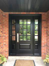 You can achieve quite a transformation by just painting your front door, but choose the paint colour carefully. This Richly Black Stained Solid Mahogany Amberwood Custom Door With 12 Divided Lights Looks St Brick Exterior House Black Exterior Doors Painted Front Doors