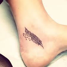 White feathers are a sign that somebody is watching over you. Elegant Feather Tattoo On Foot Feather Tattoos Foot Tattoos Feather Tattoo