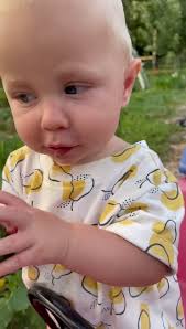 Little farmers eating vegetables from the garden