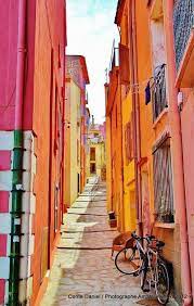 collioure pyrenees orientales france pink orange and a bike oh yes places to travel places to visit places to go