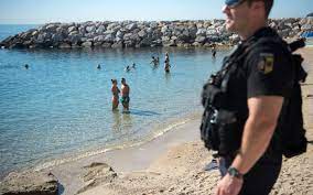 Family nudists at beach