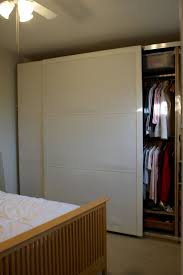 It features three sliding panels with durable and decorative wooden frames. Making Space For 3 Ikea Pax As A Room Partition Ikea Hackers