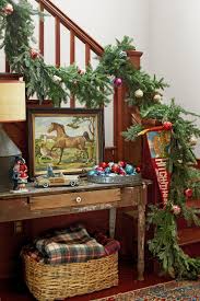 This entryway and staircase are layered with various metallics and greenery to create a festive and inviting space. 21 Best Staircase Christmas Decorations Holiday Decor For The Banister