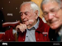 Harold Ramsay, left, 89, an Australian held prisoner by Japan during World  War II, ponders at Australian Embassy in Tokyo Tuesday, March 2, 2011. Five  former prisoners of war have returned to