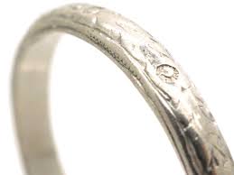 In the art deco era, a love of geometric shapes influenced fashion and jewellery styles. Art Deco Platinum Wedding Band 971m The Antique Jewellery Company