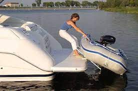 Pull Up Slide Up Davits As The Center Of Weight Comes Aboard The Hinged Arms Come Back To Rest On The Swim Platform And The Di Dinghy Dinghy Boat Cool Boats