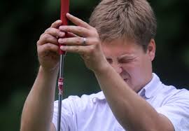 Golfers endure rain delay, heat