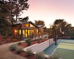Tennis courts are large, and usually fenced in but yours doesn't have to be it can be however you want to make it as long as it's the proper size. 35 Backyard Courts For Different Sports Tennis Basketball Volleyball Etc Tennis Court Backyard Backyard Court Contemporary Exterior