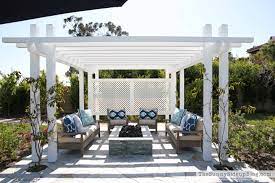 This fire pit features a black finish, drop in wood look tiles and classic lattice side panels that will easily complement your favorite patio chairs. Outdoor Pergola And Fire Pit The Sunny Side Up Blog
