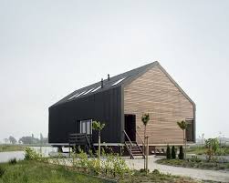 Double Storied House Wooden Black Exterior Huis Dijk Blauwestad Door Jagerjanssen Architecten Bna Modern Barn House Barn House Design Barn House Plans