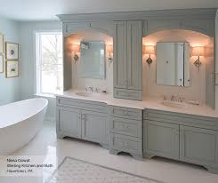 A sink and cabinet underneath are generally considered as mandatory part of every artistic floating bathroom vanity draped extensively in light grain wood. Primary Bath Cabinets Omega Cabinetry