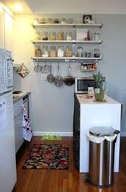 With a vast stone ledge, space shows cabinetwork of straight lines and tactful handles. 30 Small Cool Kitchens From Real Homes Small Apartment Kitchen Decor Apartment Kitchen Organization Kitchen Decor Apartment