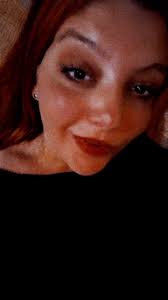 Close-Up Portrait of a Person with Red Hair