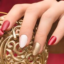 Nail technicians are able to transform a simple manicure into a true work of art. The Collection Of Red Gold And White Christmas Nail Art Ideas