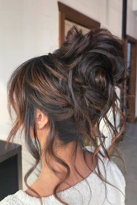 37 Elegant Wedding Hairstyles: Textured Brunette High Updo with Loose Curls