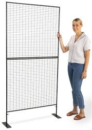 Display and go lightweight folding portable grid merchandiser display folds for easy set up and take down by simply releasing the pin locks, folding the grid panels and removing the legs. Art Fair Wire Display Wall U Shaped Design