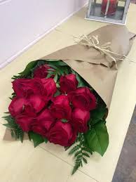 Rose (rosa princess royal), golden peach yellow flower. Roses Wrapped In Paper By Artistic Floral