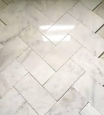 We just completed a painted diy herringbone tile kitchen backsplash. Large Herringbone Marble Tile Floor How To Diy It For Less Shine Your Light