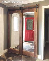 When mud and dirt start to creep their way inside, it's time to declutter and reorganize so that it's easier to keep the space clean. Walnut Framed Mirrors Doors In Our Single Track Bypassing Hardware For Entry Closet Mirror Closet Doors Closet Door Makeover Entry Closet