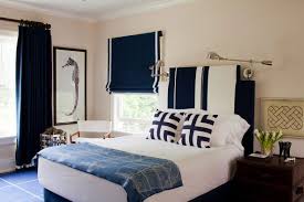 You Can T Go Wrong With Navy And White Adore The Wall Lamps And Striped Headboard In This Classic Bedro Nautical Decor Bedroom Bold Bedroom Nautical Bedroom