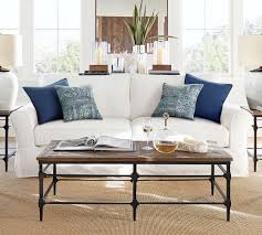 Living room artistic living room design using white slipcover sofa and brown motif cushions also rug. Pb Comfort Roll Arm Slipcovered Sofa Pottery Barn