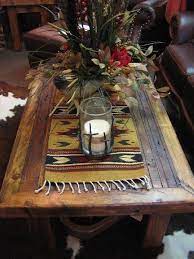 Table runners are a great finishing touch to a beautifully set dining table. Rustic Coffee Table Love The Indian Table Runner Very Cool Rustic Coffee Tables Coffee Table Decorating Coffee Tables