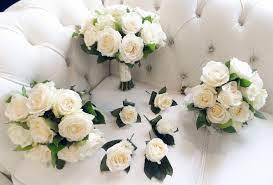 Bridesmaid's wedding bouquets with copy space on white background, isolated. White Rose Wedding Collection Buy Online Or Call 0161 737 2322