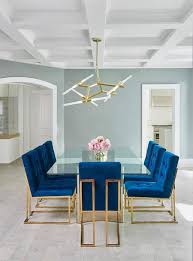 Jonathan Adler Goldfinger Blue Velvet Dining Chairs Frame A Stunning Long Glass Dining Table With A Br Velvet Dining Chairs Dining Room Blue Luxury Dining Room