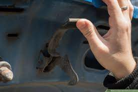 We took a look at her car, and there were some scratches around the handle, but no obvious dents. How To Open The Hood Of A Vehicle 12 Steps With Pictures