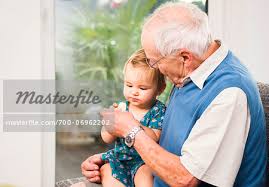 Senior Man With Baby Girl Sitting On His Lap At Home Mannheim Baden Wurttemberg Germany Stock Photo Masterfile Rights Managed Artist Uwe Umstatter Code 700 06962202