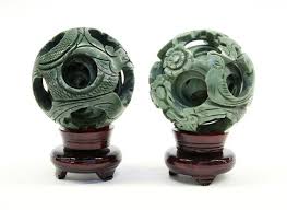 Beautiful carved ball, corresponds to the description. Four Chinese Jade Puzzle Balls