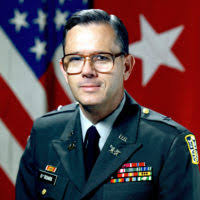 Command Sgt. Maj. Joseph Allen stands in front of Fort