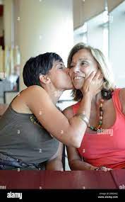Young Woman Kisses Mature Woman Affectionately Stock Photo Alamy