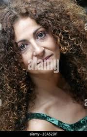 EXCLUSIVE. Singing teacher Juliette Solal poses with students Sian, Gregory  B, Bryan, Anne, Eric, Arno, Kriss and Alice during workshops in Paris,  France