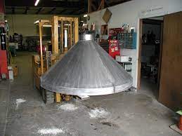 The chimneys are also available in the market at affordable prices and can be bought according to the fire pit. Steel Hood For Commercial Fire Pit Lee 39 S Custom Metal Denver Fire Pit Hood Fire Pit Chimney Outside Fire Pits