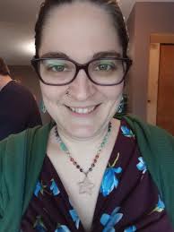 I was the Indian girl with platts holding a string of beads