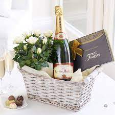 I recommend twisted ribbon everyone.chezanatormay. Champagne Gift Basket A Bottle Of Champagne A Box Of Chocolates And Some Beautiful Potted Roses Who Wouldn T L Champagne Gift Wine Gifts Wine Gift Baskets