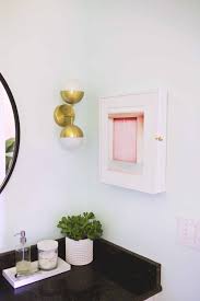 In reality, they function as a catchall for all those bathroom necessities you want close at hand but still out of sight. Hidden Medicine Cabinet Diy A Beautiful Mess