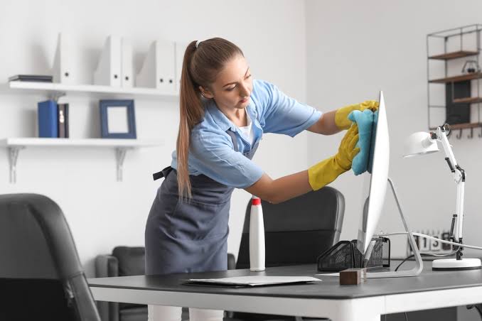 Riverbank Janitorial cleaner mopping a Falconwood office floor