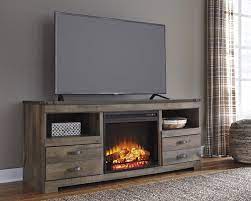 Rustic electric fireplaces feature antique oak, patina finishes, vintage styling, and many more elements that will make you nostalgic of the storied past. Trinell Rustic Large Tv Stand With Fireplace Insert By Signature Design By Ashley At Bec Fireplace Tv Stand Electric Fireplace Tv Stand Fireplace Entertainment