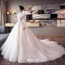 Short elegant wedding dress features off the shoulder neckline covered by illusion sheer lace overlay with long sleeves. Chic Beautiful Champagne Wedding Dresses 2018 Ball Gown Lace Appliques High Neck Backless Long Sleeve Cathedral Train Wedding